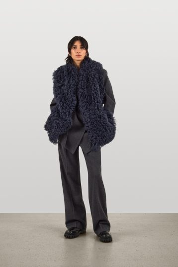 Mid Length Natural Cut Navy Shearling Gilet | Womens | Gushlow & Cole - model full length front
