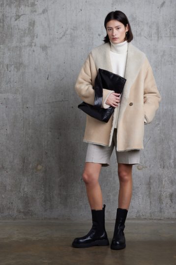 Cream Boxy Shearling Coat | Womens | Gushlow & Cole - model front with clutch bag