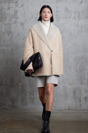 Cream Boxy Shearling Coat | Womens | Gushlow & Cole - model front with clutch bag walking