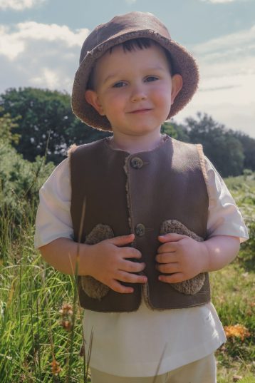 Albie Camel Kids Teddy Shearling Gilet | Kids | Gushlow & Cole - on boy model outside