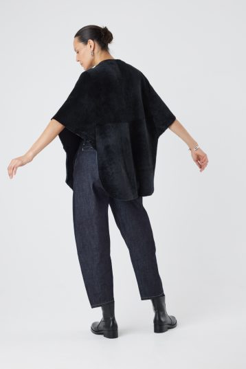 Black Collarless Shearling Cape | Womens | Gushlow & Cole- model full length back