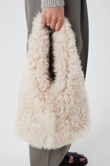 Cream Shearling Slouch Bag | Womens | Gushlow & Cole - model crop holding bag