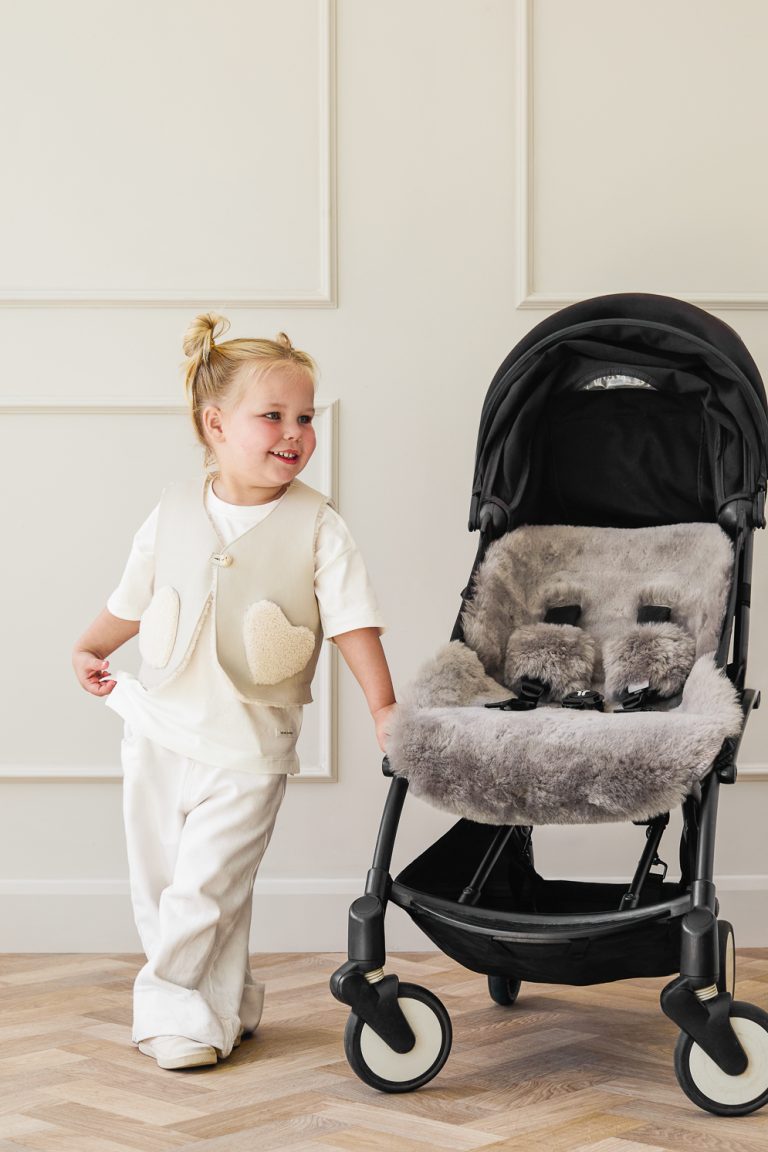 Edith White Shearling Heart Gilet | Kids | Gushlow & Cole-on model with pram