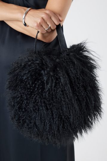 Mongolian Shearling Black Saddle Bag | Womens | Gushlow & Cole-model with bag cropped in